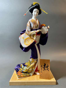 Geisha doll with small drum