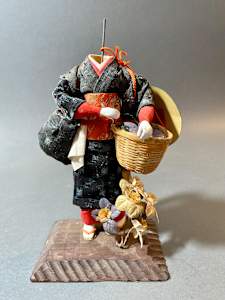 Doll with basket and flowers