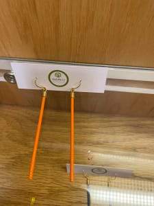 Orange stick earring
