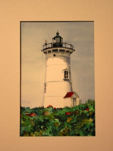 Lighthouse with Red Flowers