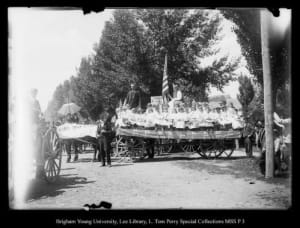 [Many children on a float, sign says Utah's best crop]