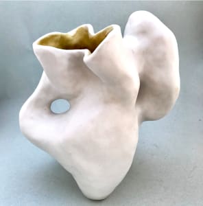 white vessel with yellow interior