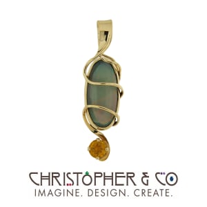 CMJ A 21091  Yellow gold pendant designed by Christopher M. Jupp, set with opal cabachon and yellow citrine.