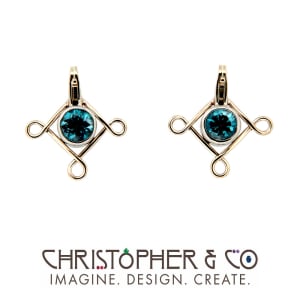 CMJ F 13116   Gold element pair set with Cambodian blue zircons designed by Christopher M. Jupp