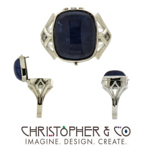 CMJ K 22023  Platinum ring set with tanzanite cabachon designed by Christopher M. Jupp
