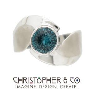CMJ W 21001  White Gold ring set with concave cut Blue Zircon handcut by Richard Homer and designed by Christopher M. Jupp.