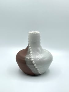 Red and white bud vase with dots