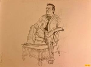 Untitled (Man sitting in a chair with a footstool)