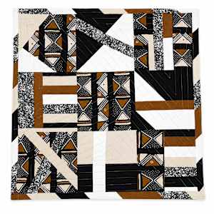 Geometric modern quilt with tribal prints
