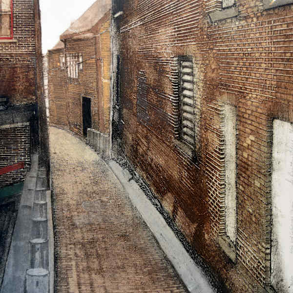 Alleyway with cylindrical posts by Grace Bentley-Scheck, Image 1.