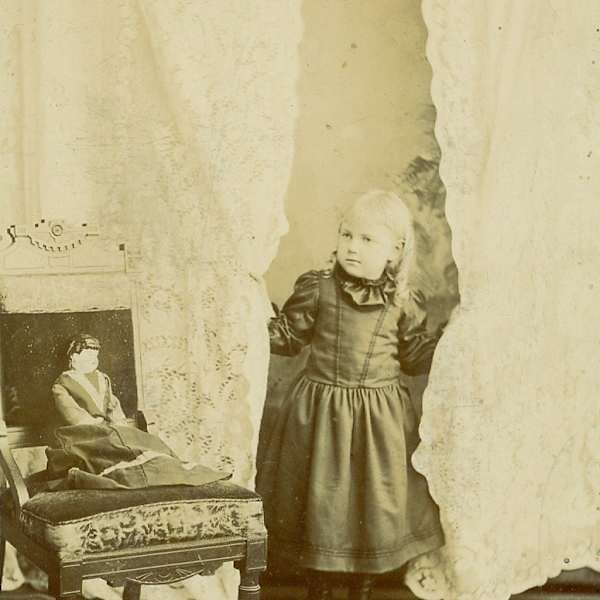 Girl with Doll by W.L. or Ada A. Gowe, Image 1.