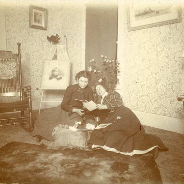 Perusing Photos in the Parlor by William H. Langdon, Image 1.