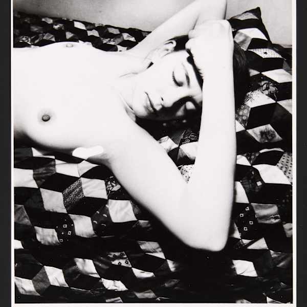 Black and white photograph of a sleeping nude female torso by Bill Brandt, Image 1.