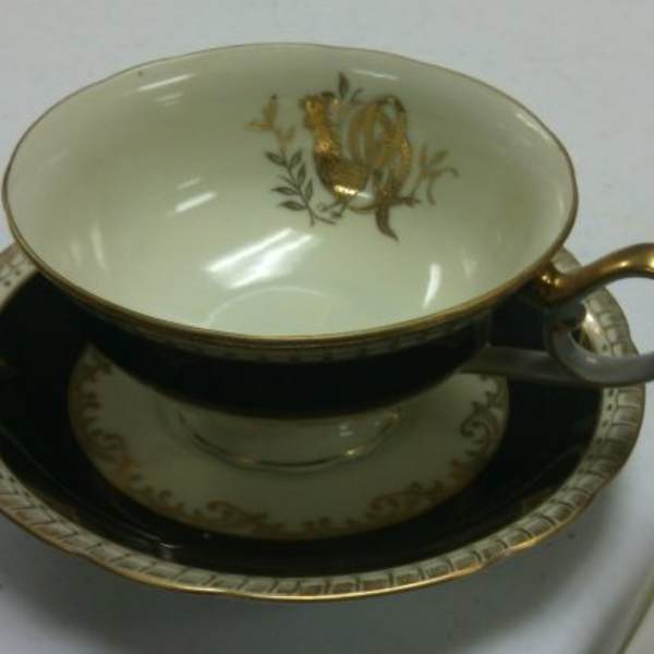Cup and Saucer with Black and Gold Design by Del-Mar, Image 1.