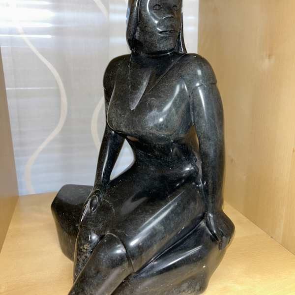 Woman sitting on Rocks by Steve Genaille, Image 1.