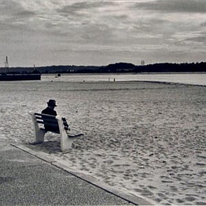 Man on Bench at Beach by N. Jay Jaffee