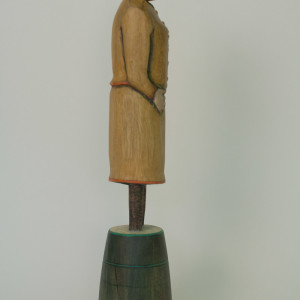 Woman in Ochre Suit (side view) by Eve Whitaker