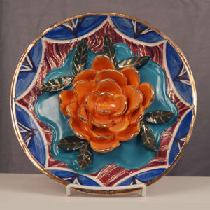 (orange flower on turquoise center) by Janet Huclzel