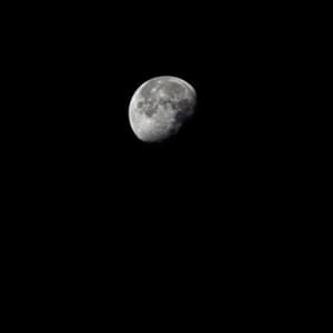 Dead Military Navigation Satellite (Cosmos 985) Near the Disk of the Moon by Trevor Paglen
