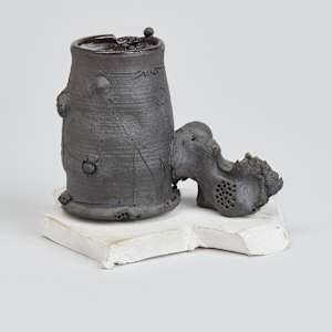 Black Cup with White Saucer by George Sacco