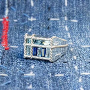 Indigo Blues by Stefano Lonzano  Image: Topaz & Spinel set into Continuum Silver (Palladium, Sterling Silver). Each of the nine thread seam points are individually woven in 3D design software.