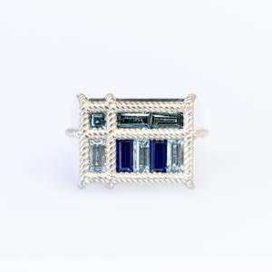 Indigo Blues by Stefano Lonzano  Image: Topaz & Spinel set into Continuum Silver (Palladium, Sterling Silver). Each of the nine thread seam points are individually woven in 3D design software.