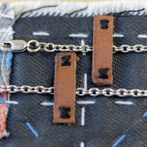 Tea Time by Stefano Lonzano  Image: Removable sterling silver chain secured to placemat 
