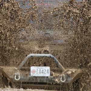 Young Man just flippin' by Tami Hritzay  Image: Bantam Jeep Heritage Festival Mud Pit