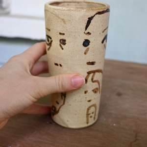 face eating face cup by ELLEN MARIE BLAZICH 