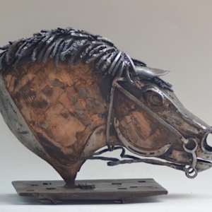 Broken Reins by Tolley Marney  Image: View 2 of Broken Reins. Tolley forges the steel and hammers by hand. Each sculpture is truly one-of-a-kind.