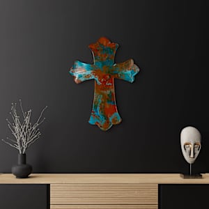 Clay and Fire by Debra Wilson  Image: Striking against a dark wall, “Clay and Fire” radiates as a beacon of divine strength and artistic devotion — where the cross stands in every season and setting.
