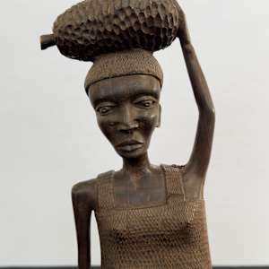 Woman with bundle on her head 