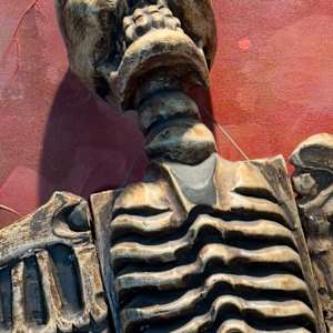 Untitled (maroon with skull) by Rick Leman 