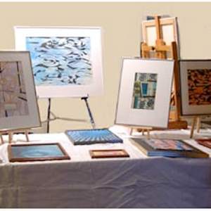 Studio and Exhibition Images by Amy Ione  Image:  The College Art Association Annual Meeting in 2003 included an artist display afternoon. On the table are small watercolors, acrylics, and ink paintings.