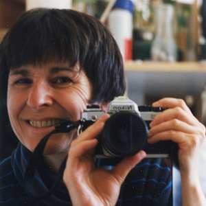 Photographs over the years by Amy Ione  Image: Amy Ione, circa 1990. The Nikon camera has been replaced by an iPhone.