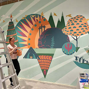 Mural at Christ Covenant Church in Atlanta by Lindsey Veil  Image: Lindsey Veil hard at work mixing custom colored paint.
