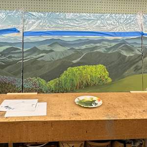 The Journey of Light by Lindsey Veil  Image: Work in Progress in Lindsey Veil’s studio. After staining the sky, I had to cover it up with plastic. If paint gets on the sky, then I have to redo the entire thing because it can’t be fixed.