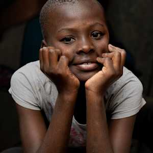 Boy on Motorcycle by George Salter Photography