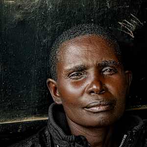Man on Black Wall by George Salter Photography