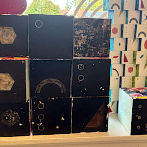 10-Block Prime Numbers Puzzle  (6 in. cubes) by Juliet Fiss  Image: Prime numbers on dark background with key block