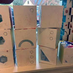 10-Block Prime Numbers Puzzle  (6 in. cubes) by Juliet Fiss  Image: Prime numbers on light background with key block