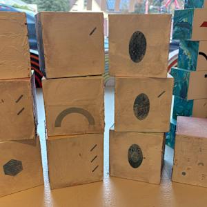 10-Block Prime Numbers Puzzle (4 in. cubes) by Juliet Fiss  Image: Prime numbers on light background with key block