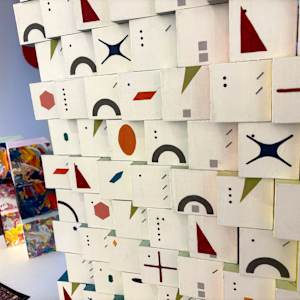 100-Block Prime Numbers Puzzle (10x10 grid - 2.5 inch cubes) by Juliet Fiss  Image: Installation - Side 1