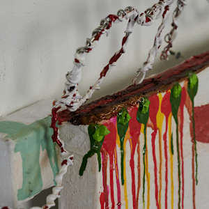 Juice Box by Lisa Petsu  Image: Detail top of canvas with reworked juice box, wire and oil paint.
