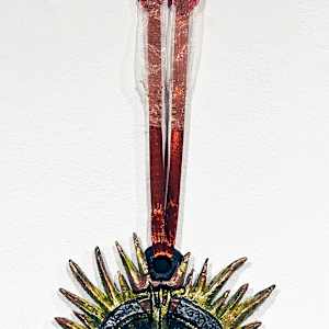 The Gift: Burning Earth, Lily's Gift, & Keystone by Tashina Marie  Image: Burning Earth-Draws upon Southwestern native art to depict a world where our natural resources are not protected. It shows imagery of drought and fire caused by overconsumption and climate change. A single drop of water hangs from the point. This is meant to be a statement on how important it is to protect our ecosystems and what the world could become without people and organizations like the NPS actively working to protect our natural places from development and corporate greed.