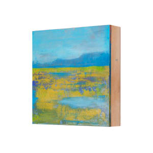 "Landscape #16" by Steven McHugh  Image: Side view of "Landscape #16" by Madeline Island artist Steve McHugh. This small landscape masterpiece, capturing the wetlands and bogs of Madeline Island, is crafted with oil and cold wax on a wood panel measuring 8" x 8" x 2.5". The texture and bold combination of blues and yellow-green make this piece a vibrant addition to any space. Versatile in its display, it can be hung on a wall or placed on a shelf, offering flexibility for any decor. Shipping is included in the U.S., making it easy to bring a piece of Madeline Island's tranquility into your home.

This abstract landscape paintings upper half of the painting showcases a serene sky in various shades of blue. Below the sky is a horizontal band of greenish-yellow, suggestive of a field or meadow. Interspersed within this band are patches and streaks of blue and green, giving the illusion of texture and depth, reminiscent of reflections or shadows on a grassy terrain. The painting transitions into more vibrant yellows and further textured blue areas towards the bottom, adding richness and an ethereal quality to the landscape. The composition uses a blend of bold and muted colors to evoke a sense of calm and natural beauty.