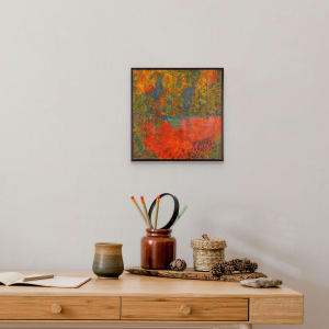 "Tranquil Forest" by Steven McHugh  Image: Room view of  "Tranquil Forest" by abstract painter Steve McHugh. This original painting bursts with intense colors and intricate detail markings, creating a bold and captivating piece of art. The intense reds are offset by textures of greens, yellows, and blues, evoking the feeling of being surrounded by a lush and vibrant forest. The small pond in the foreground, complete with basalt rocks along the shore, was inspired by the stunning natural beauty of Madeline Island in Lake Superior, as part of the Apostle Islands Lakeshore. Add a touch of nature and serenity to your space with this stunning piece from the artist's studio.

Painting is mixed media on masonite 12" x 12" panel and is framed with metal frame. Layers are oil and cold wax, wax crayons, and  graphite with palette knives and even beach hand.

This artwork is a vibrant abstract painting, bordered by a simple dark frame. The composition is distinguished by a dynamic interplay of colors and textures that suggest a natural landscape setting. The canvas is dominated by fiery shades of orange and red that create an almost molten, flowing effect at the bottom portion which represents a frog pond and a forest floor awash with autumn leaves.

Above this area, vertical elements in blue and darker tones stretch upward, representing trees within this chromatic environment. Interspersed among these vertical forms are specks and patches of bright yellow and green, mimicking the chaotic beauty of foliage caught in the light. The interweaving of these colors is achieved through a mix of blending and layering techniques, giving the work a sense of depth and movement.

The abstract nature of the painting allows for multiple interpretations, but it strongly evokes the essence of a forest during the fall season, full of intense warmth and vivacity. The overall effect is both striking and captivating, inviting the viewer to explore the details within the tumult of colors.

Shipping and sales tax will be established after purchase.