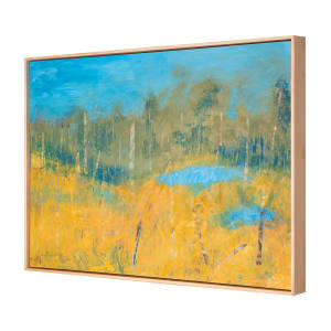 "World Within" by Steven McHugh  Image: Side view of "World Within," the tranquil world within this original landscape by Madeline Island abstract painter Steve McHugh. This stunning 22" x 30" mixed media oil and cold wax painting on wood panel is a true piece of art. The warm tones of yellow tall grasses in the lower area contrast beautifully with the clear ponds of blue, all set against a background of trees. Displayed in a wood gallery floating frame, this serene piece will bring a sense of calm to any space and is sure to captivate any art lover. Add a touch of nature to your collection with this exquisite work of art.

The "World Within"  is a landscape painting featuring a serene scene. The foreground is dominated by rich golden hues,  representing a field of tall grasses or a meadow. Vertical lines, suggesting tree trunks, are scattered throughout the landscape, transitioning from the yellow foreground to a more subdued green middle ground. The green gives way to a blue area,  bodies of water, adding a calming element to the scene. The background is primarily a soft, blended blue sky with hints of green, indicating a forested area. The painting uses a mix of bright and earthy tones, creating a tranquil and harmonious atmosphere.

Sales tax and shipping fees will be determined after purchase.