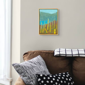 "Conversations" by Steven McHugh  Image: Room view of "Conversations," an original abstract landscape featuring ancient trees grouped next to a bog area, brought to life through bold contrasting colors and textures of green against reds, blues, and teals. Painted by Madeline Island artist Steve McHugh, this mixed media oil and cold wax masterpiece measures 14.5" x 10.5" x 2.5" and comes framed in a gallery- floating frame in wood tones. This painting captures the essence of the natural beauty found in the Apostle Islands, making it a captivating addition to any art collection. Based on a location on Madeline Island on Black Shanty Road.  Shipping and sales tax caluated after destination is determined. Explore the depth and conversation within nature through this stunning piece on stevemchughart.com.

This abstract landscape is painted piece features vertical yellow and blue lines that resemble tall, slender trees in a stylized manner. These elements emerge from a textured base of green and red, giving an impression of a forest or dense vegetation. The background consists of washed-out, overlapping hues of blue and grey-green, creating a sense of depth and atmospheric perspective. The hazy, muted tones in the background contrast with the vibrant, textured colors in the foreground. The overall composition is abstract, with a focus on color and form that evokes a natural, organic scene. 