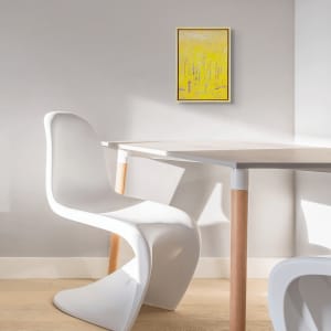 "Revelations" by Steven McHugh  Image: Room view of  "Revelations," a bold abstract landscape painting by Madeline Island artist Steve McHugh. This captivating piece represents a forest with tree trunks in contrasting colors against a luminous yellow background, created with oil and cold wax on a wood panel measuring 14.25" x 10.5" x 2.5". Framed in a natural wood gallery floating frame, it adds an elegant touch to any space. Steve's unique style and deep connection to the Apostle Islands are infused in every brushstroke, offering both visual pleasure and profound inspiration. Elevate your collection with this stand-out work from a renowned mixed-media non-representational abstract painter.

The artwork is a painting primarily featuring vertical lines representing  trees. The color palette predominantly consists of vibrant yellows, lending a bright and warm tone to the piece. Additional colors like hints of purple, blue, and red intersperse the yellow, creating a sense of depth and texture. The background is a muted yellow-green, evoking a serene atmosphere. The painting is enclosed in a simple wooden frame that complements the natural theme of the artwork. The overall impression is abstract, with the shapes and colors blending together to create a lively yet harmonious composition.

Shipping and sales tax added after destination is determined.